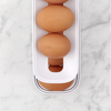 Globetrek° EggHolder: Automatisk Rulle Plassbesparende Eggedispenser